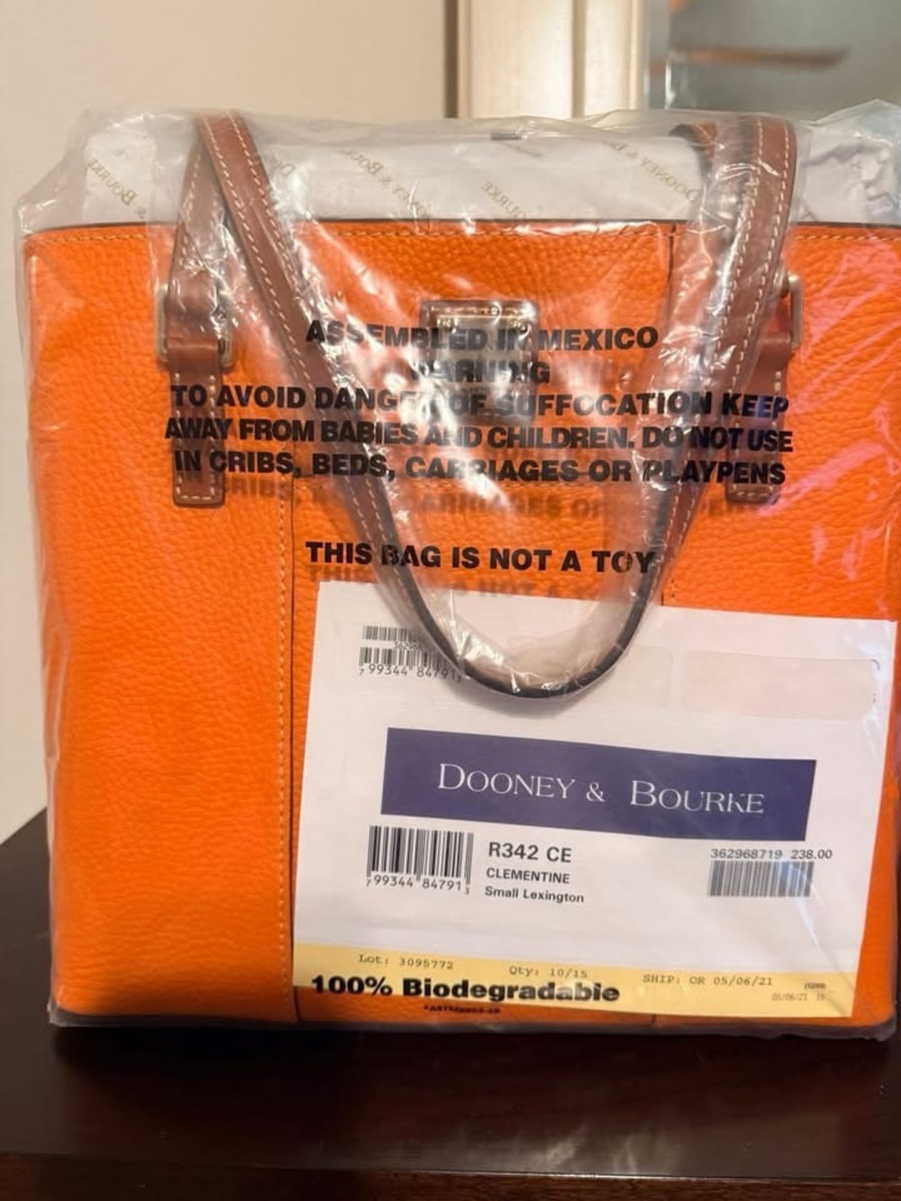 Dooney & Bourke Orange Pebble Leather Satchel with Brown Trim